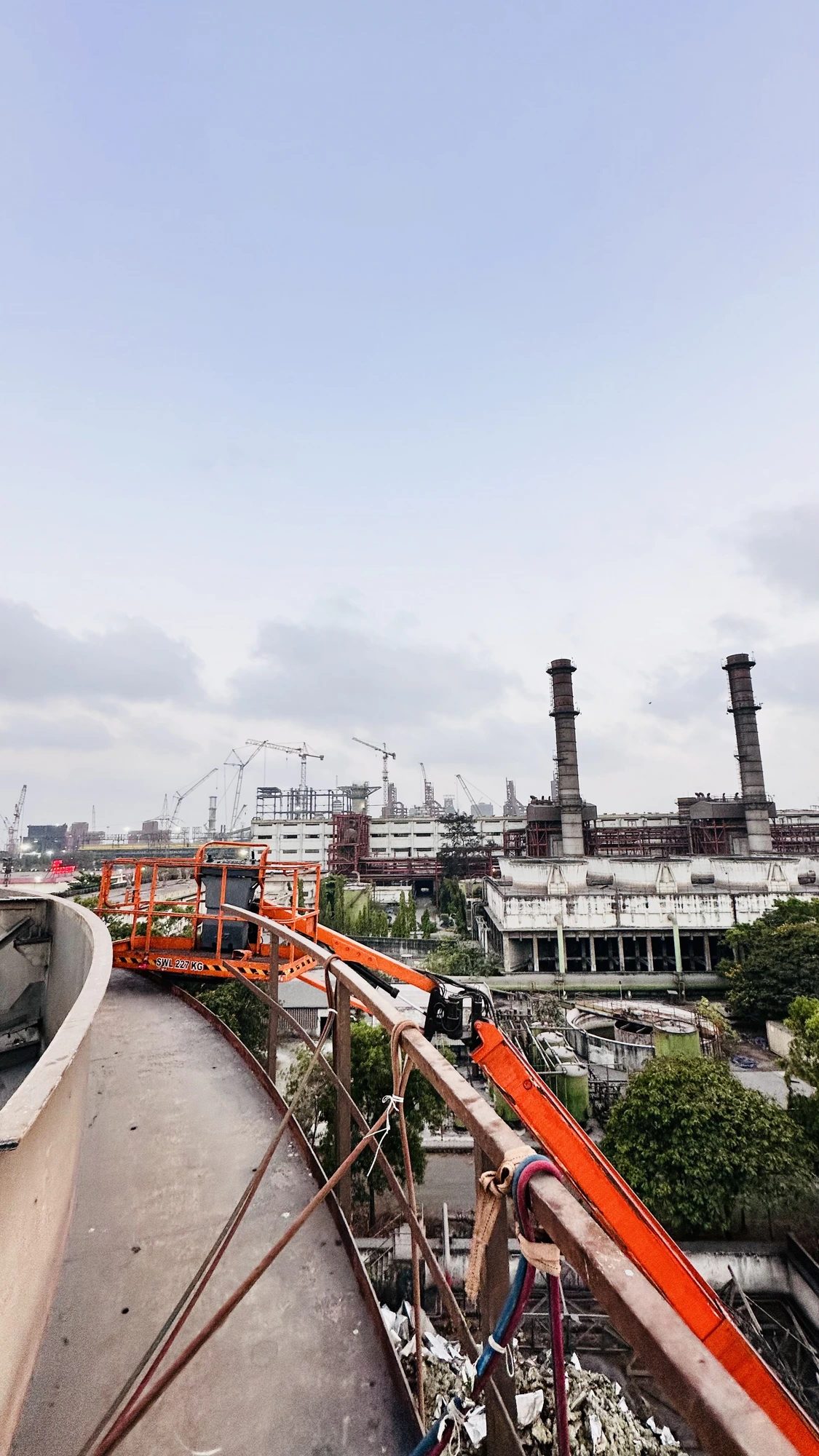 Industrial site with steel structure and crane